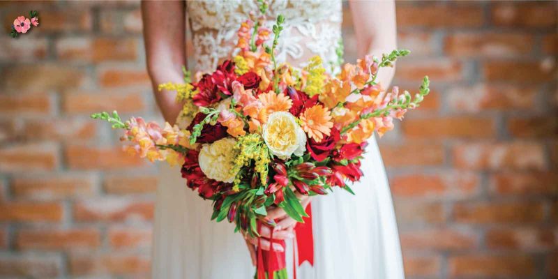 Bouquet da sposa dai colori caldi, rosso, giallo, arancione